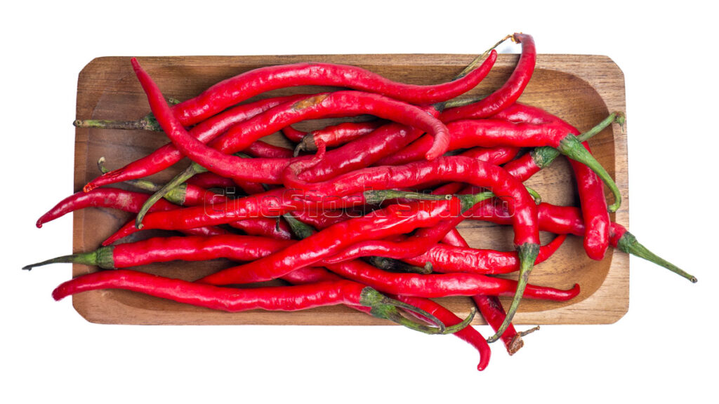 Top view of long red chili peppers isolated on a clean white background