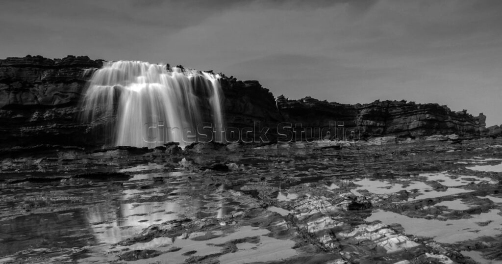 Natural Beauty of Karang Taraje Water Flow Waterfall in Black and White.