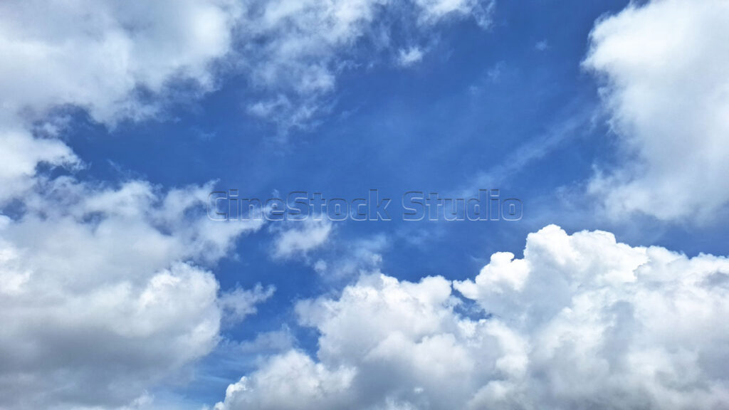 Blue Sky with Soothing White Clouds and blue sky background.
