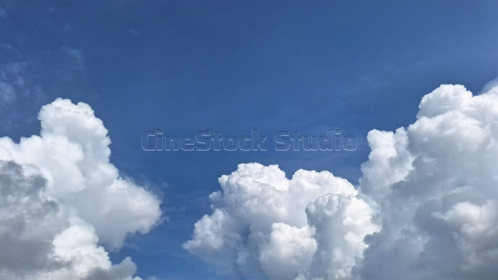 Cotton Clouds Adorning the Bright Blue Sky.