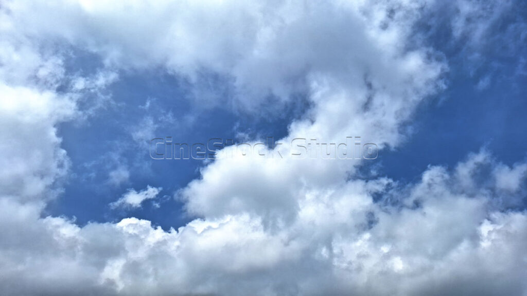 White Clouds Adorning the Bright Blue Sky.