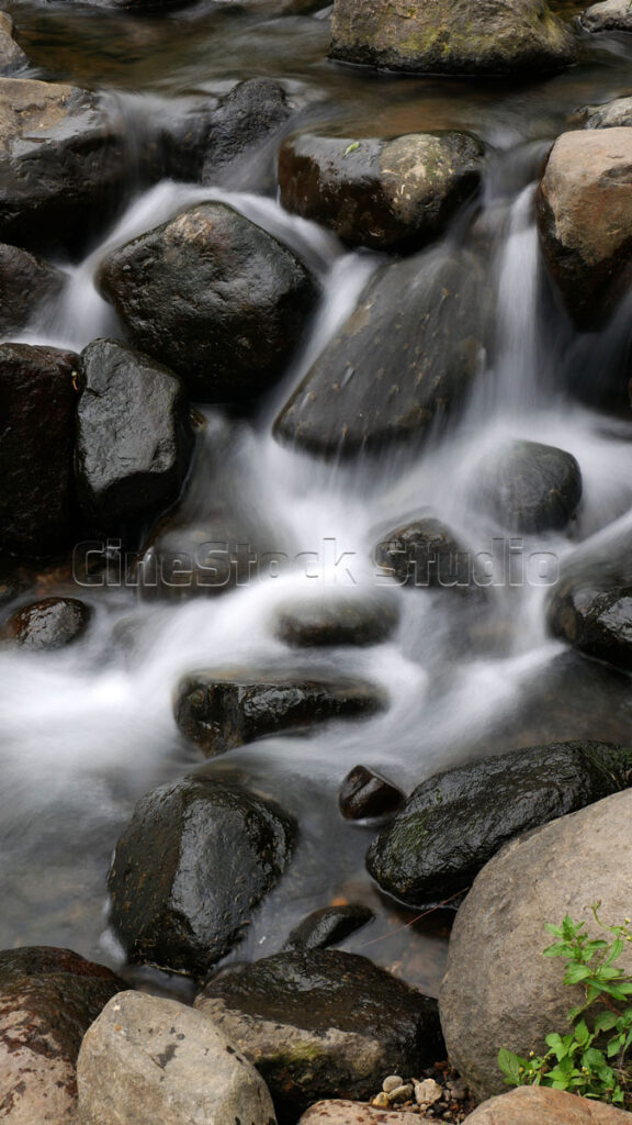 Clear Stream Flowing Among Large Rocks.