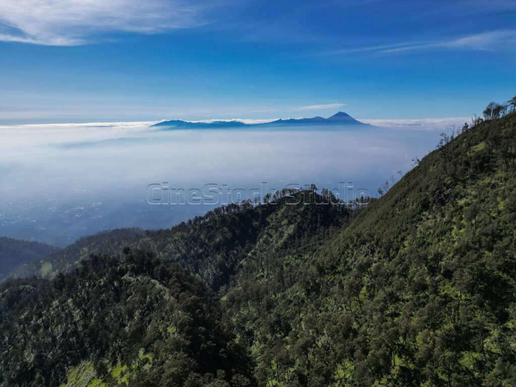 Natural view of mountains, blue sky and thin mist in the morning.