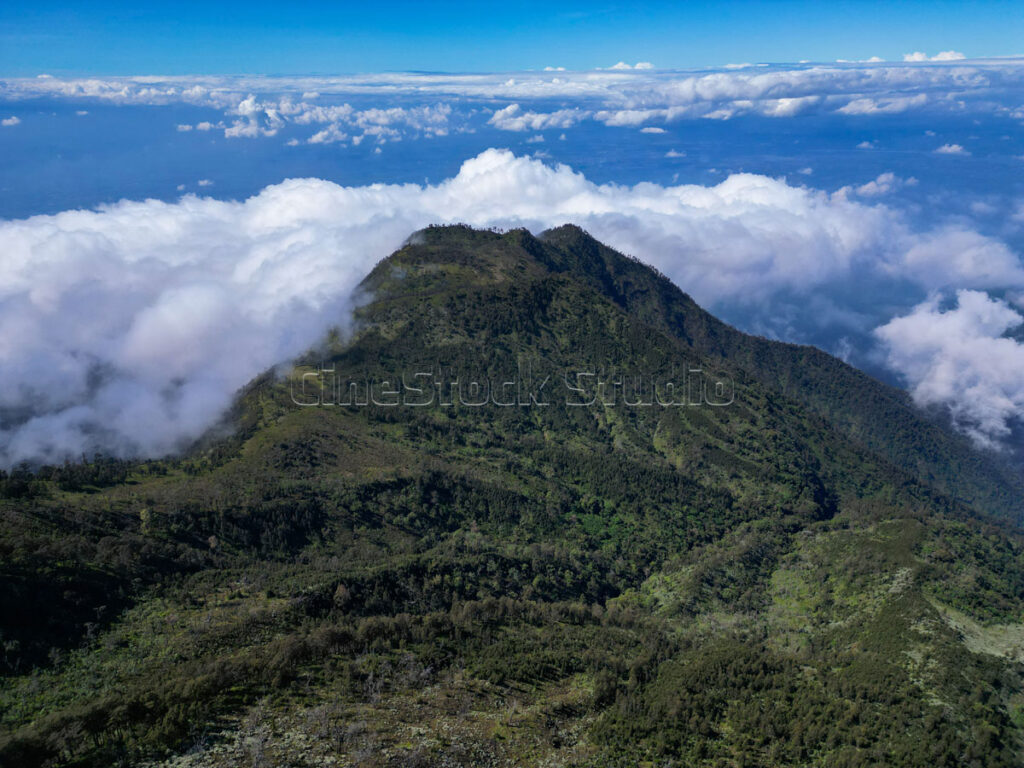 Aerial view of Mount Kawi with Blue sky and dramatic cloudscape.