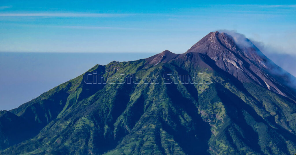 View of Indonesia's most mountains active volcano Photo taken from the Mount Merbabu hiking trail.