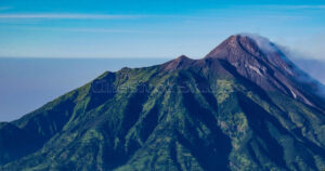 View of Indonesia's most mountains active volcano Photo taken from the Mount Merbabu hiking trail.
