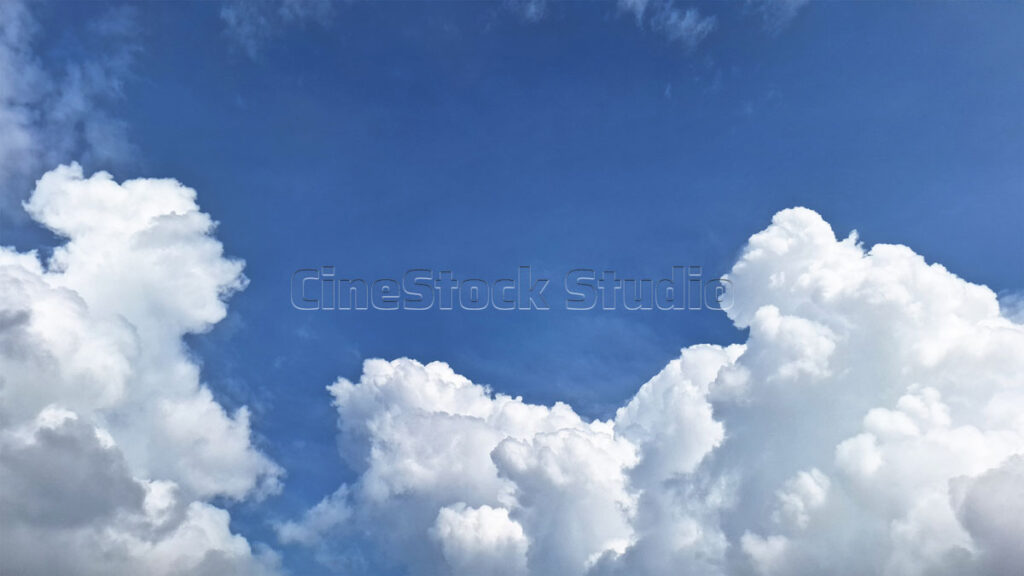 View of a Clear Sky with Clumpy Cotton Clouds.