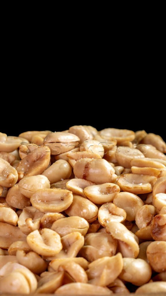 Close-up a pile of salted roasted peanuts.