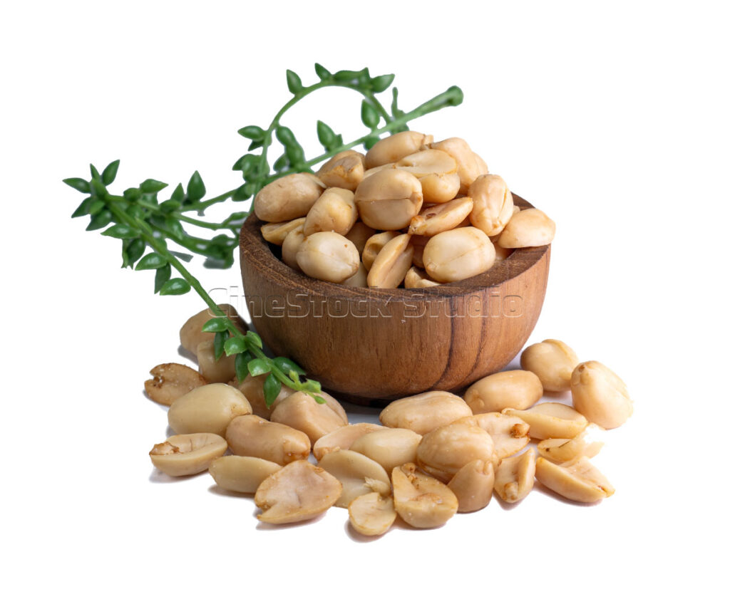 Healthy Snack of Peanuts with Decorative Leaves on White.