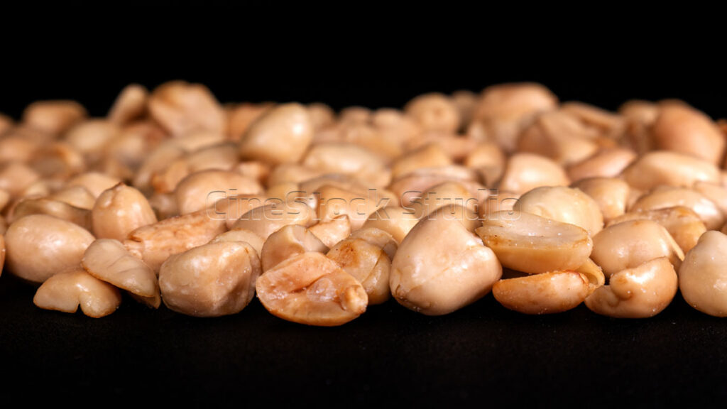 Roasted Peanuts on Black Background.