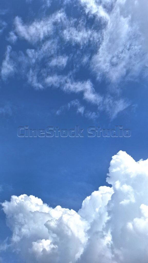 Thick White Clouds Floating in the Blue Sky.