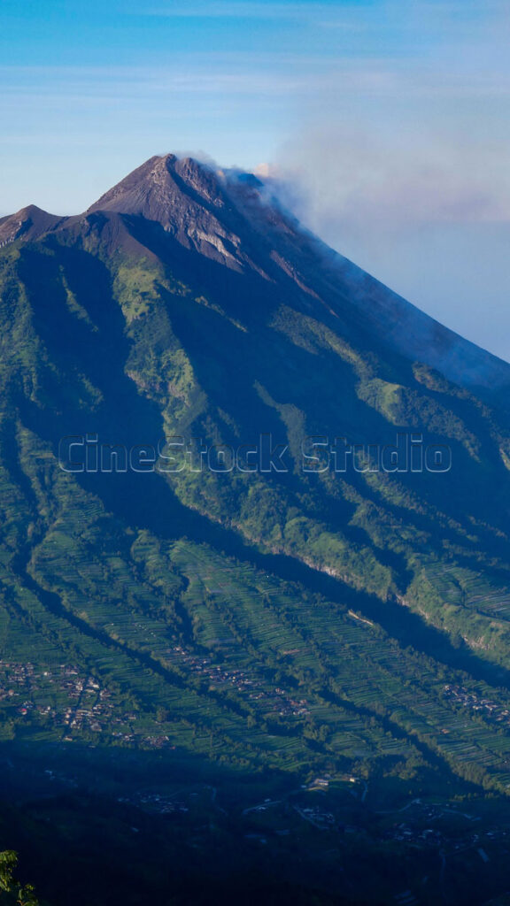 Villages and farmland at the foot of the towering Mount Merapi.
