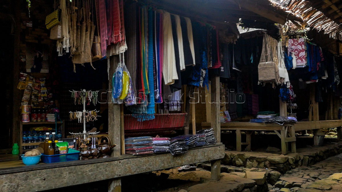 Various woven products and accessories displayed in a traditional Baduy workshop