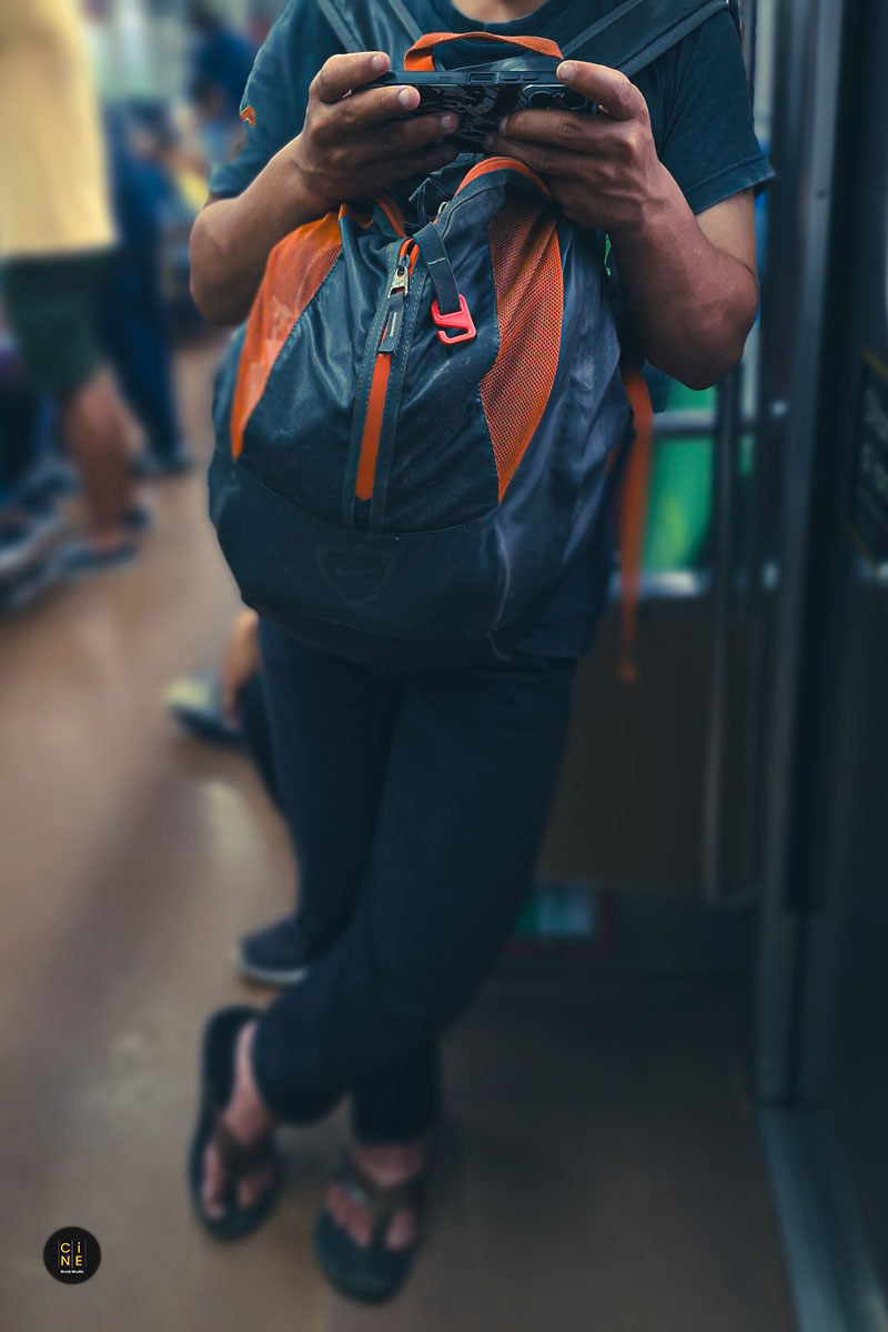 Detailed view of a traveler occupied with digital worlds
